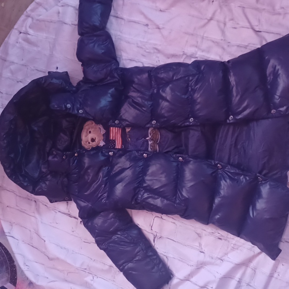 Polo long puffer coat with logo on back, flag on arm, and teddy bear inside